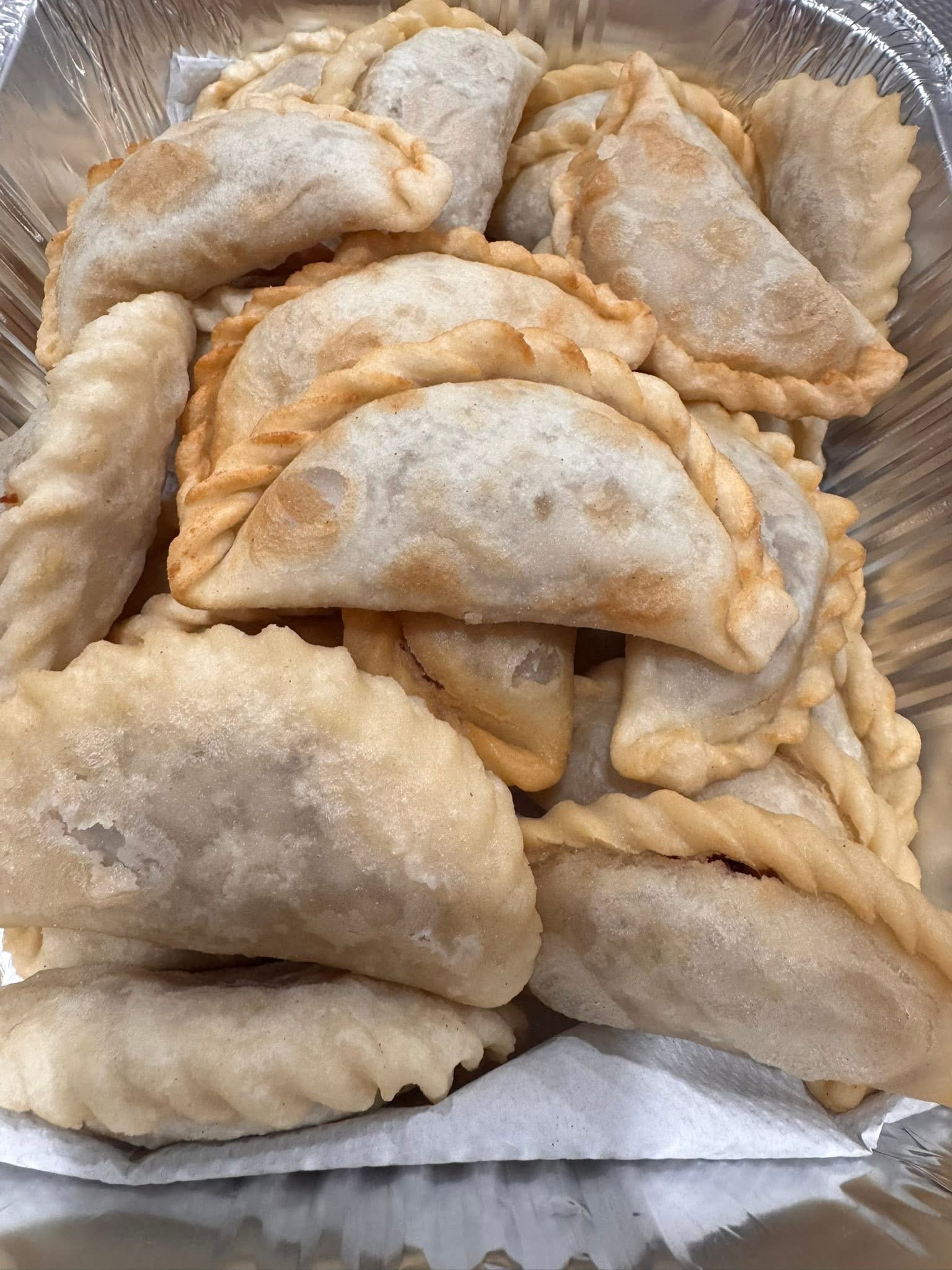 Narkel Puri — coconut-filled fried pitha